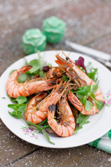 Grilled shrimps served outdoor in winter