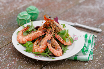 Grilled shrimps served outdoor in winter