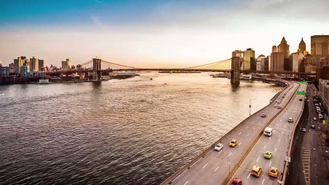 Brooklyn Bridge, boats sailing East River and FDR drive traffic