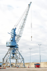 Harbor crane on rails in port.
