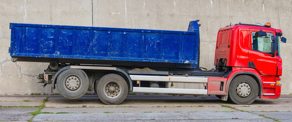 Red truck with a removable container. © M-Production