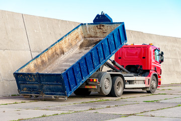 Red truck with a removable container.