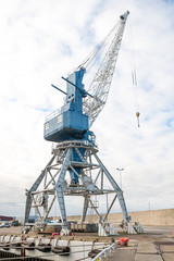 Fototapeta na wymiar Harbor crane on rails in port.