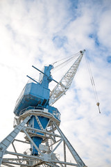 Fototapeta na wymiar Harbor crane on rails. Perspective view.