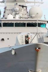 Close-up view of naval ship with gun.
