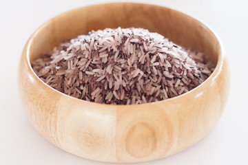Berry rice in wooden bowl