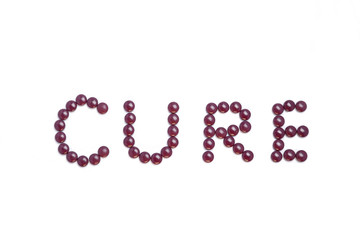 Cure written with purple pills
