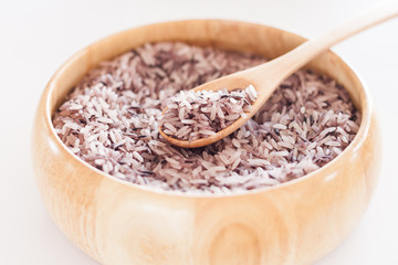 Berry rice in wooden bowl