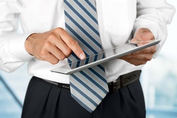 Ipad. Business man holding a contemporary digital tablet