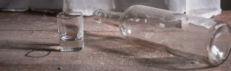 Close-up of empty bottle and glass