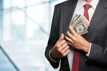 Currency. Pocketing the money