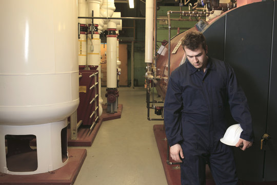 maintenance engineer checking technical data of heating system