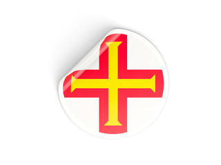 Round sticker with flag of guernsey