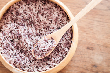 Berry rice in wooden bowl