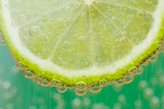 Green lime with water splash