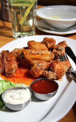 Bbq chicken wings with dips and salad