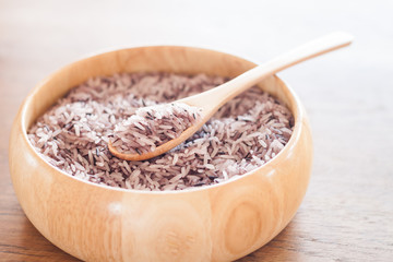 Berry rice in wooden bowl