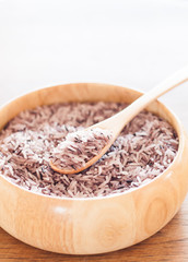 Berry rice in wooden bowl
