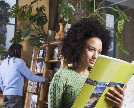 African woman reading book