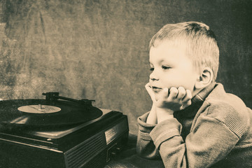 boy listening to retro music player
