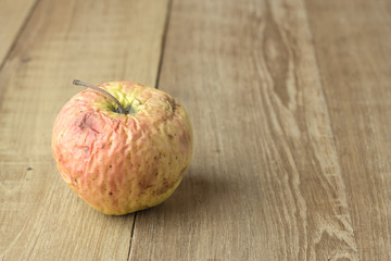 sear apple on wood background
