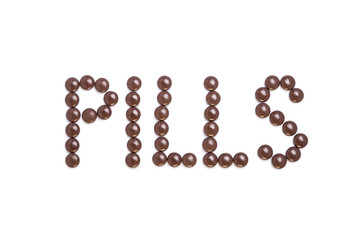 Pills written with brown pills