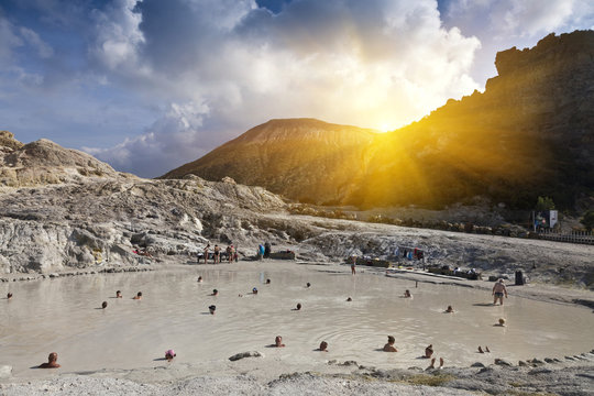 People bathing in hot springs, Isle Vulcano, Sicily, Italy