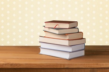 Book. Vintage old books on wooden deck tabletop against grunge
