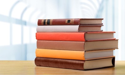 Aged. Books on the table. No labels, blank spine.