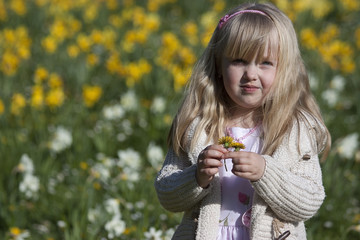 Little girl in spring sunny park
