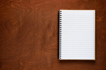 Notepad on wooden background