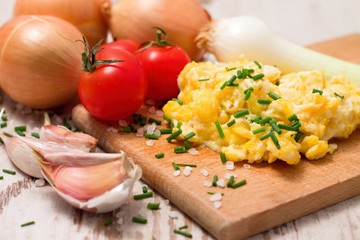 Breakfast with scrambled eggs and tomatoes