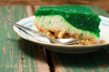 Single portion of green kiwi cake