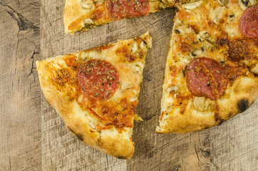 Italian pizza on wooden table
