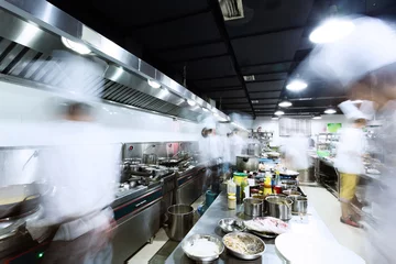 Keuken spatwand met foto modern kitchen and busy chefs © zhu difeng