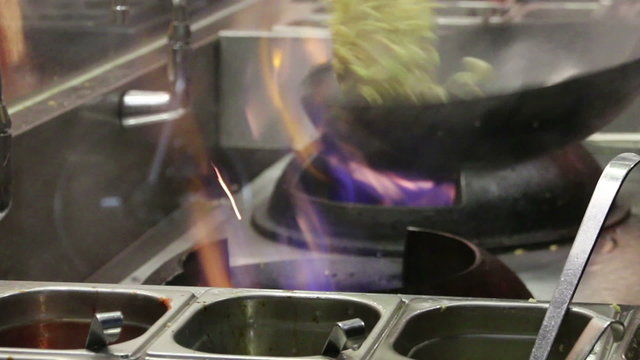 Frying potatoes in a fast food restaurant. Closeup