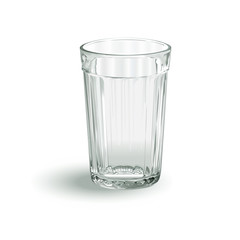 one transparent empty faceted glass on a white background