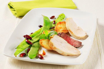 Chicken and beef meat with vegetable garnish