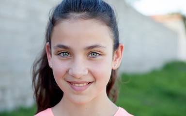 Portrait of a beautiful preteen girl with blue eyes