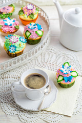 Sweet muffins with sweet decoration and coffee