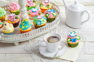 Sweet cupcakes with sweet decoration and coffee
