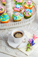 Delicious muffins with sweet decoration and coffee
