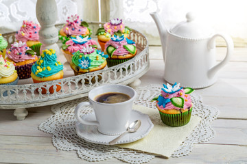 Fresh muffins with sweet decoration and coffee