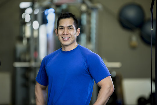 Pacific Islander man smiling in gym