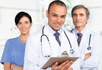 Fototapeta premium Doctor. Portrait of successful doctors standing together and