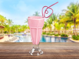 Berry. Pink milk shake isolated on white