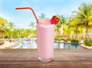 Milk. Glass of strawberry milkshake on white background