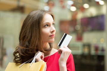 Bags. Young woman holding shopping bags