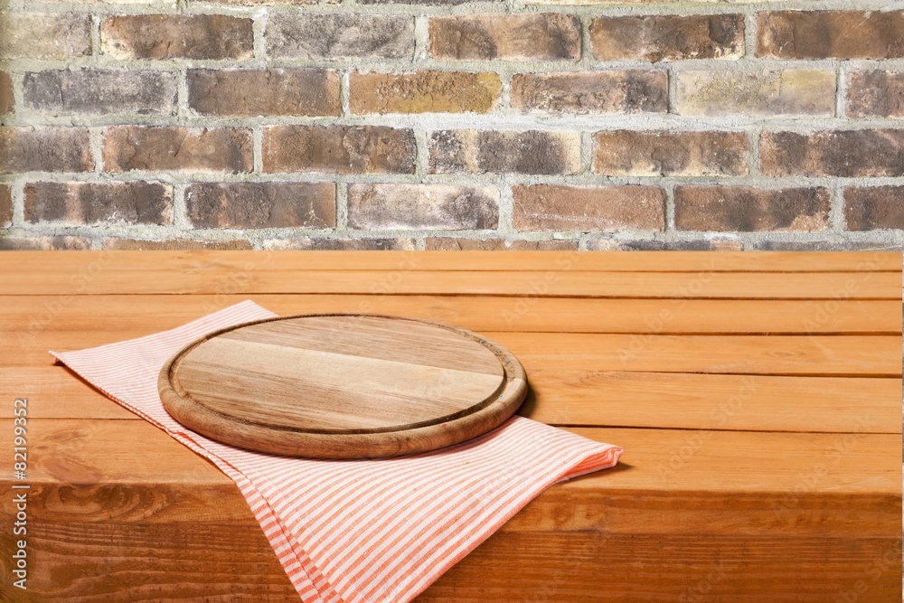 Sticker Advertise. Wooden board stand on tablecloth over grunge