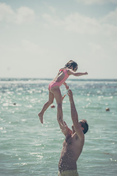 Father and daughter at the ocean